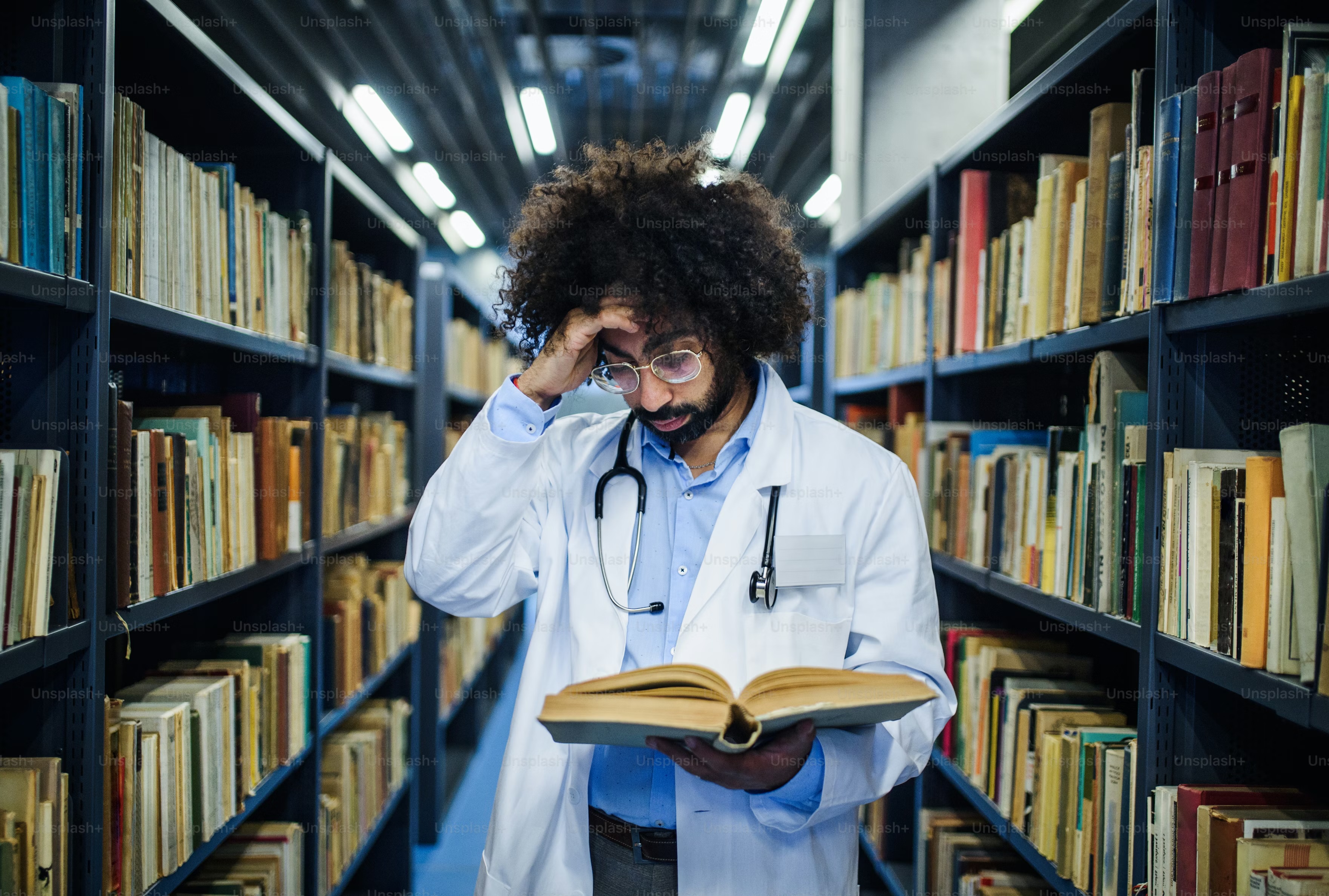 Academic researcher at a university library desk
