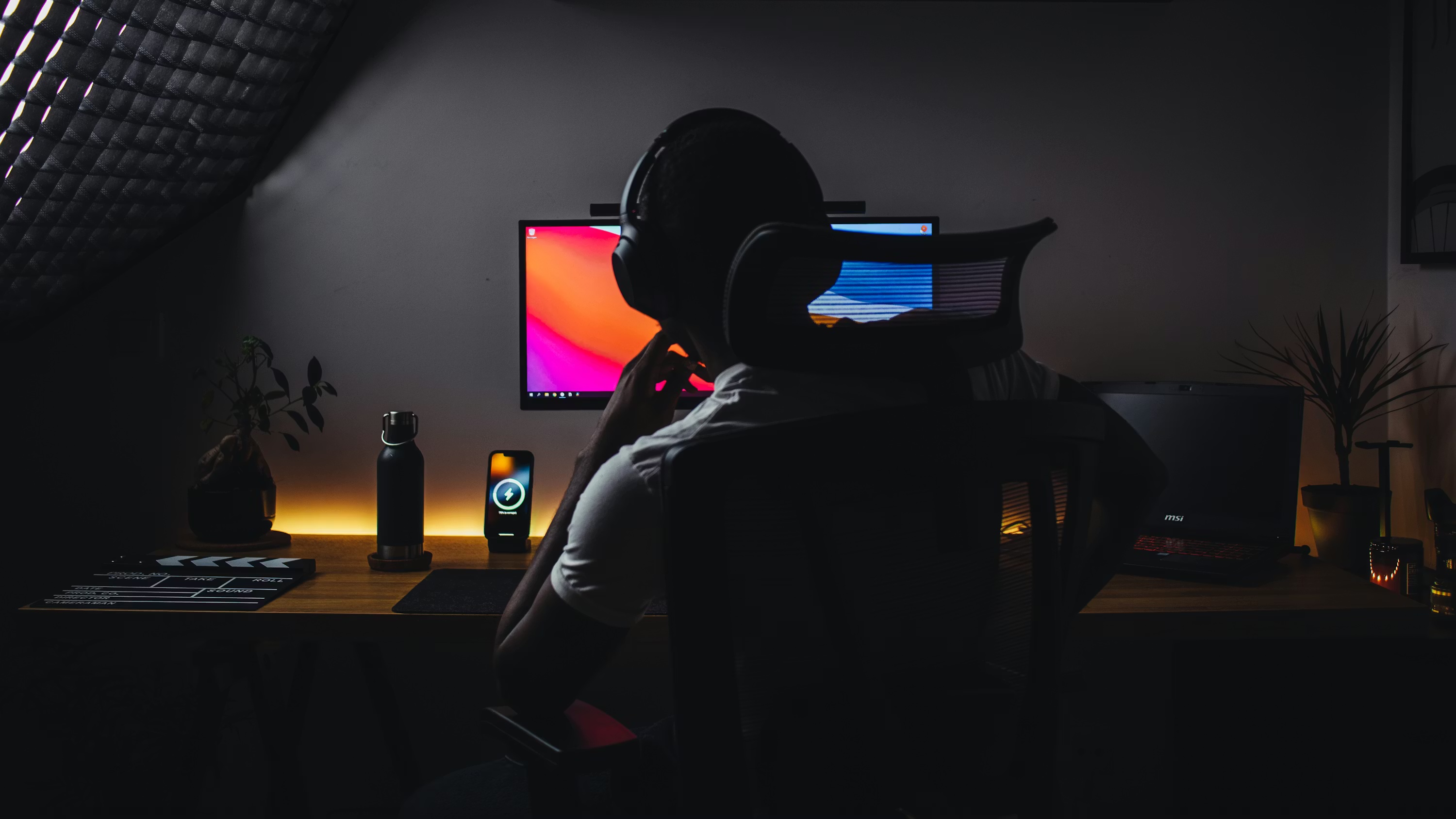Content creator at their home studio desk